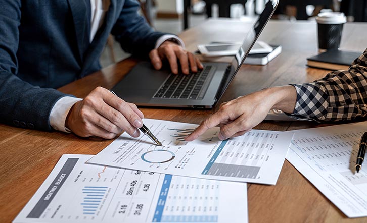 Stock image - meeting discussing charts